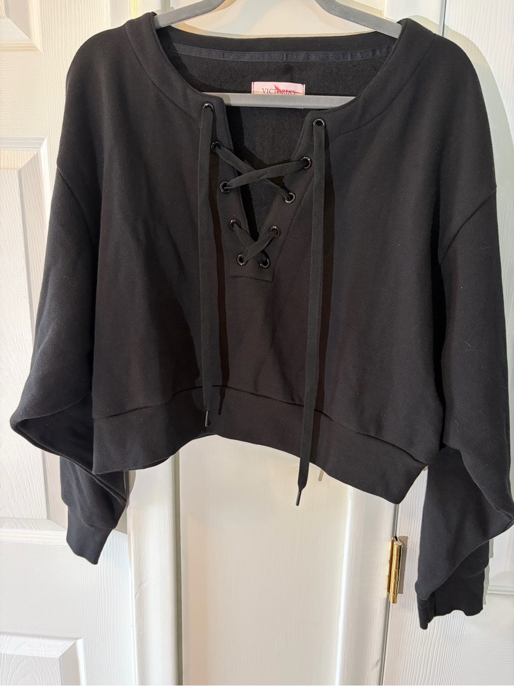 Victoria’s Secret fleece lined cropped sweatshirt with lace up detail.
